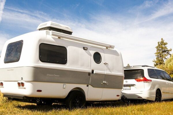 Best Travel Trailers: A Guide to Top-Rated Models A top-rated travel trailer parked in a scenic outdoor setting, showcasing its modern design and features, perfect for RV enthusiasts seeking adventure and comfort