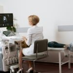 Medical professional performing an ultrasound examination on a patient in a clean, modern clinic, showcasing New Century Health technology and patient care